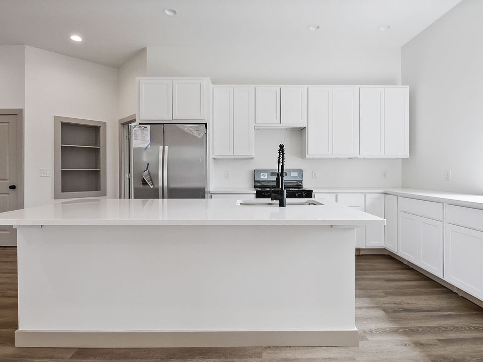 Gorgeous sun filled kitchen with TONS of counter space and natural light. Microwave will be getting installed over the stove.
