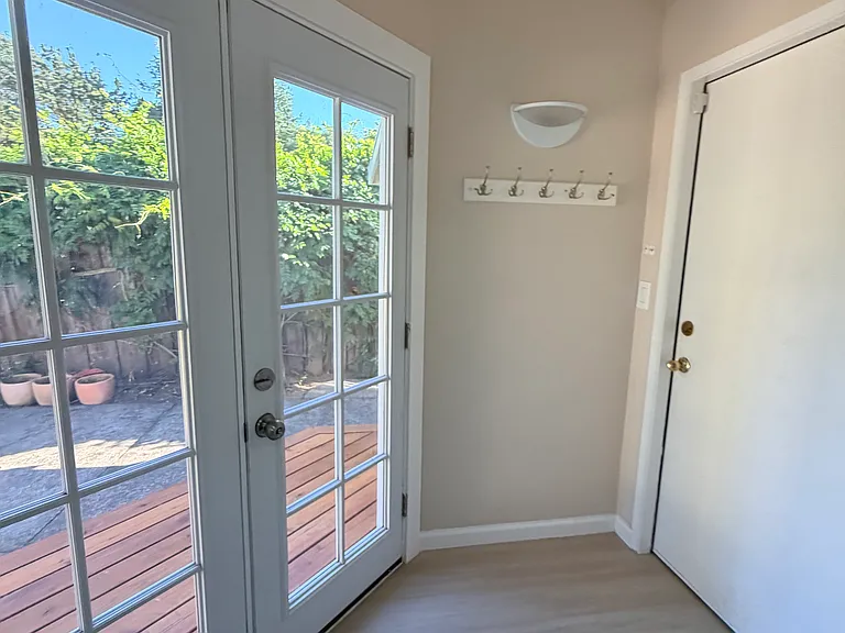 Garage and patio entryway with French doors