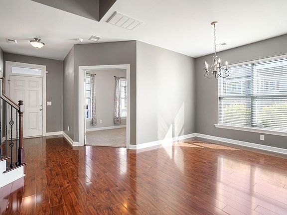 Entryway, with office to the right, and large open dining in the center.