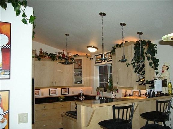 Large kitchen with custom maple cabinets