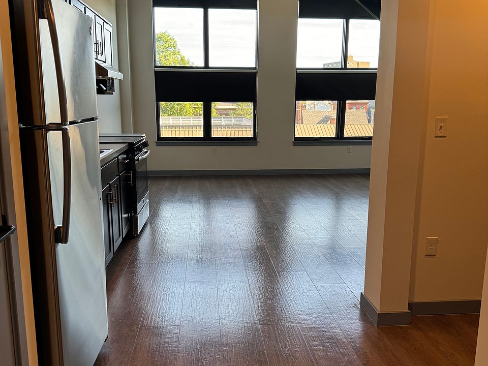 Kitchen with Stainless Steel appliances open concept to the living room area