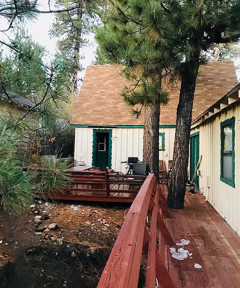 Deck with doors into laundry and large bedroom.