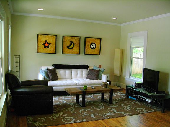 Living Room With Crown Molding, Recessed Lighting, Hardwood Floors.