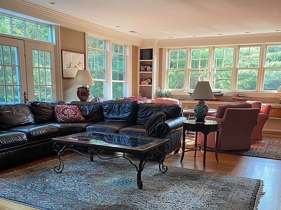 Large comfortable living room with smart TV, large fireplace