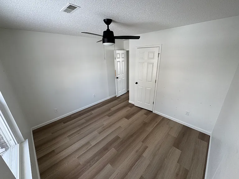 Third bedroom perfect for guests, an office, or additional living space.