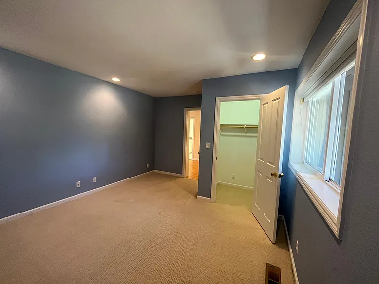 Bedroom #1 has a walk-in closet and comfortable plush carpeting.