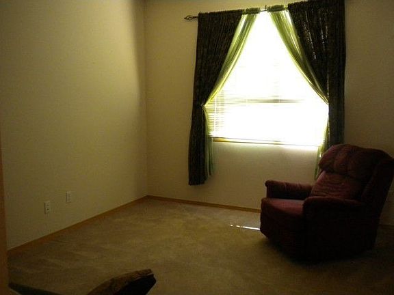 The living room features a view to the west and plenty of wall space for your flat screen TV, art or