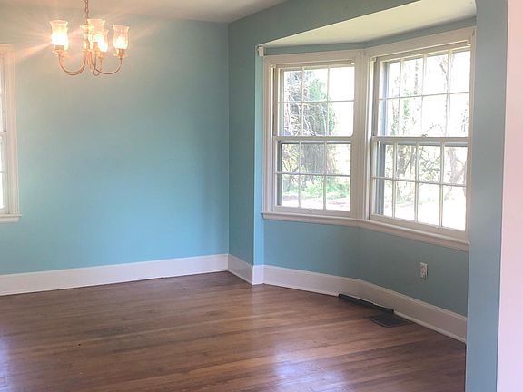 Dining Room with Archway, Baywindow and Hardwood floors.