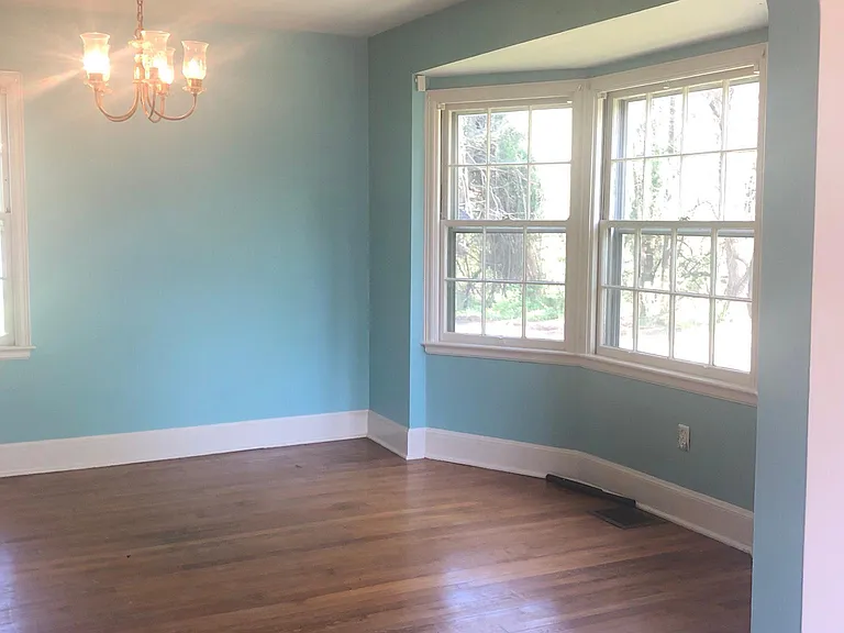 Dining Room with Archway, Baywindow and Hardwood floors.