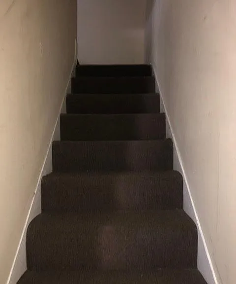 Stairs to the bedrooms and bathroom on the second level