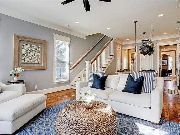 The family room is open to the kitchen and features gleaming hard wood floors.