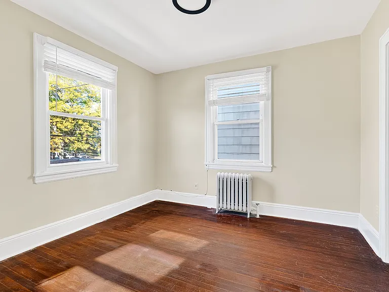Bedroom with hardwood floors.