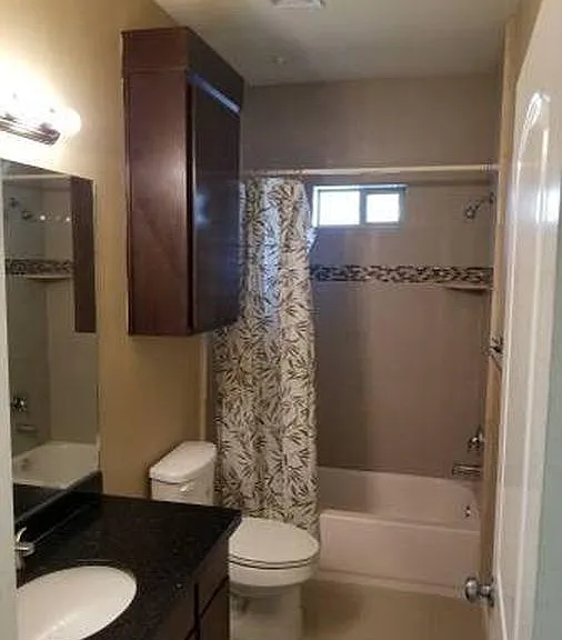 Shared bathroom with tub, the (curtain not included)