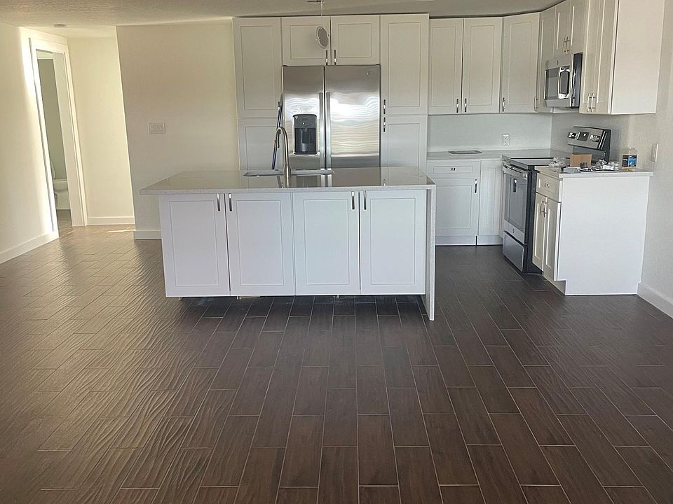 eat in kitchen facing water front waterfall quartz countertops