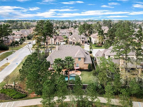 Back view of home with plenty of side walks.