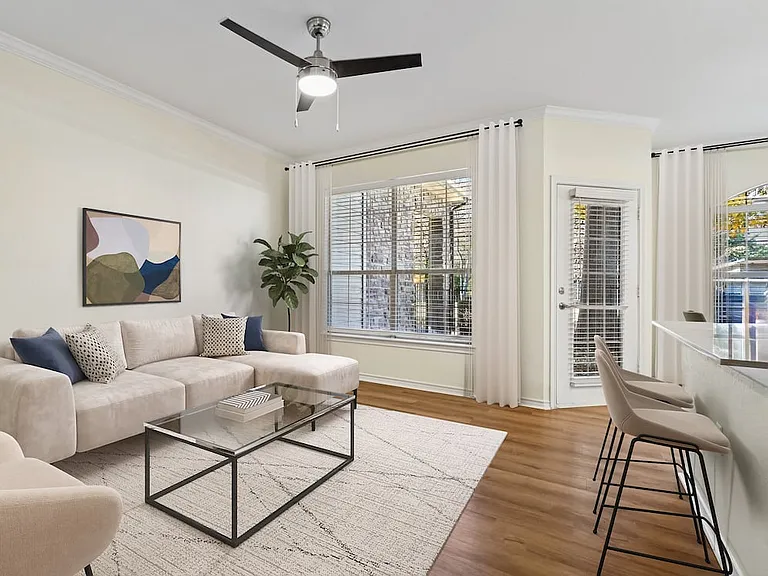 Renovated Package I living room with hard surface flooring