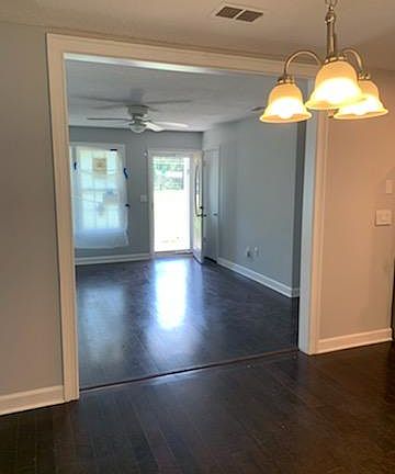 Front entrance view from kitchen and dining area