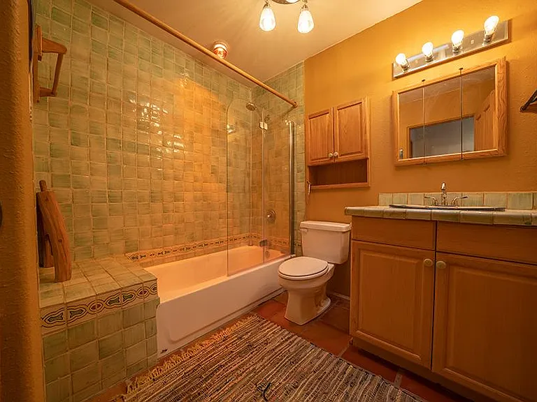 @nd bathroom with window and skylight