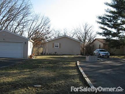 Back of home
						:
						Two asphalt drives with deep two car garage. Plenty of parking here!