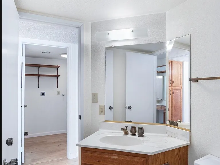 Jack and Jill style bathroom accessible from hallway and bedroom #2