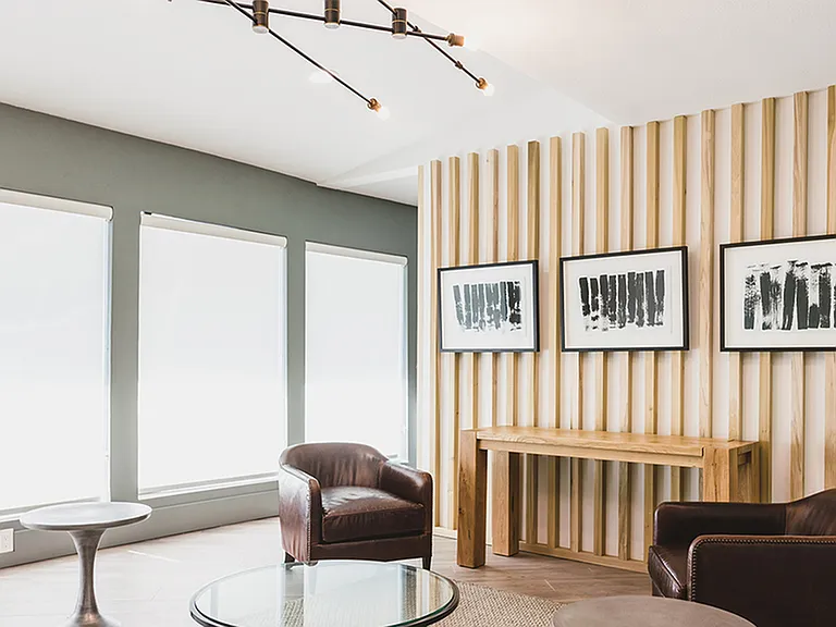 Brightly lit clubroom with ample seating for work or play