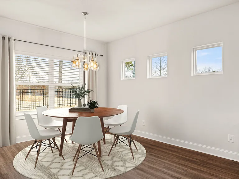 Elegant dining area bathed in natural light.