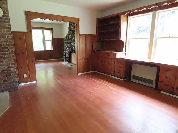 Dining room looking toward living room. Please note, fireplace does not work.