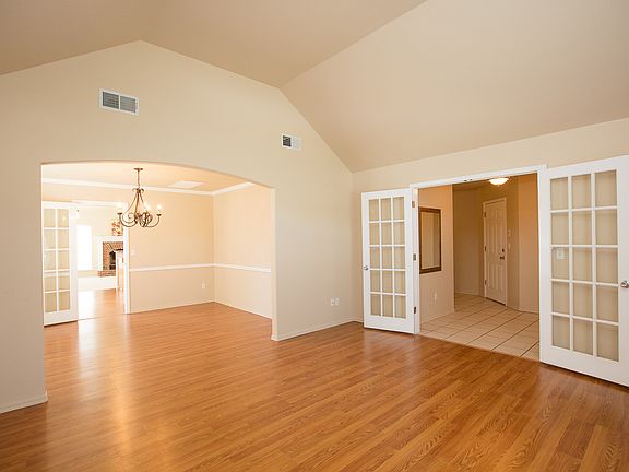 VIEW FROM FORMAL LIVING THRU TO FAMILY ROOM - LOTS OF NEW WINDOWS N FLOORING THRU-OUT
