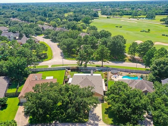 This amazing aerial view of the home shows proof that there are NO BACK NEIGHBORS! Also, pictured to the right are some of the Windrose Gulf Club putting greens!