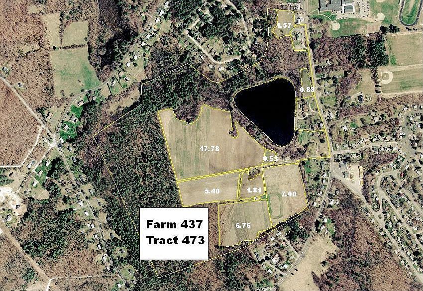 AERIAL VIEW OF 97 ACRE FARM WITH DIAMOND SHAPED POND 