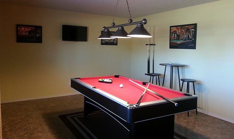 Game room with pool table and 32" TV