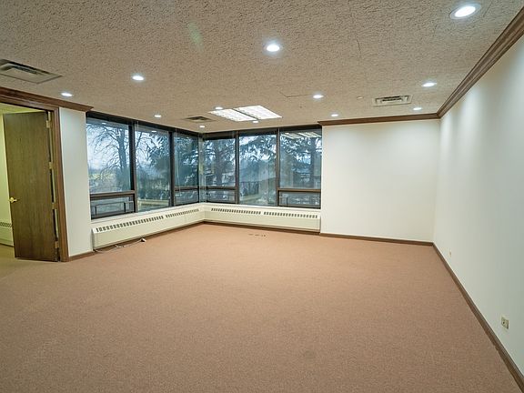 Executive Suite corner office with pond views