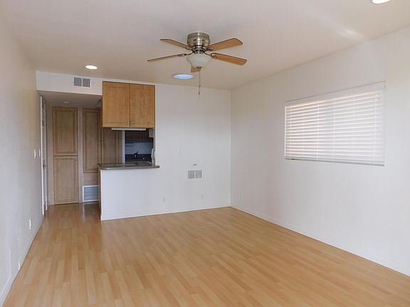 Living room with ceiling fan and solatube for extra light