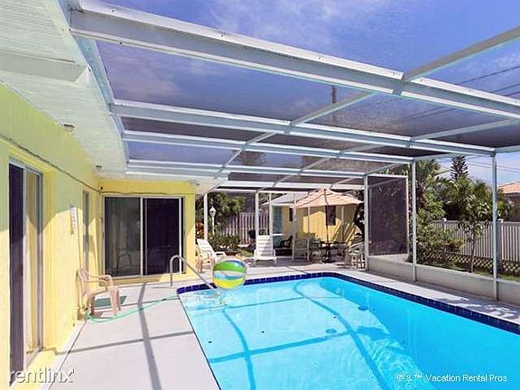 Relax and enjoy our specatcular heated pool and screened lan