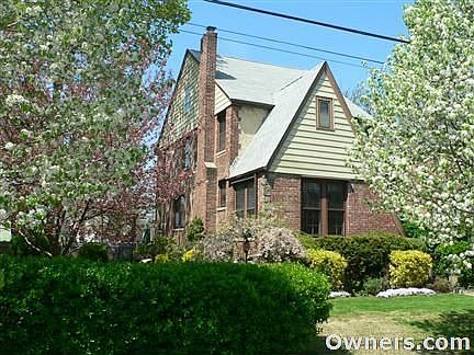 Tudor surrounded by flowering trees