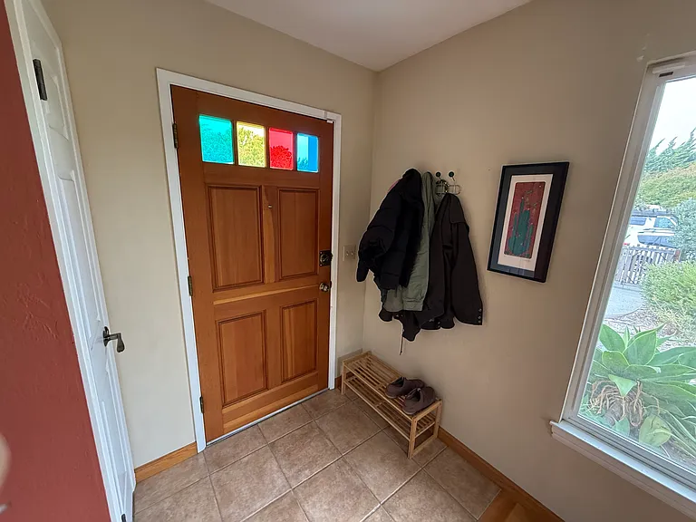 Front door and coat closet