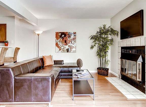 Living Room with wood burning fireplace - hearth & wall tile are being updated.