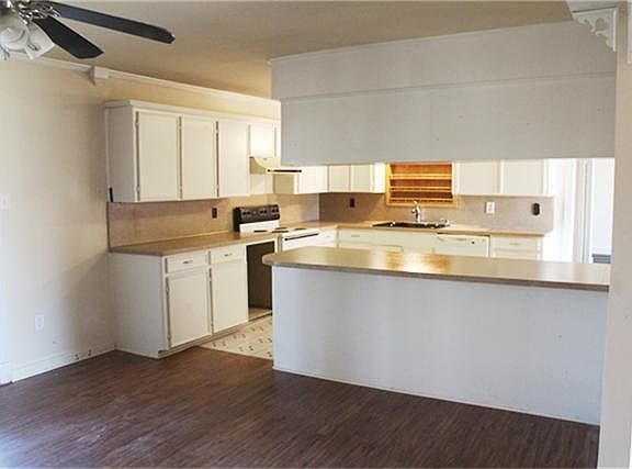 ADDITIONAL VIEW OF KITCHEN WITH TONS OF COUNTER TOP SPACE AND ROOM FOR A WINE COOLER
