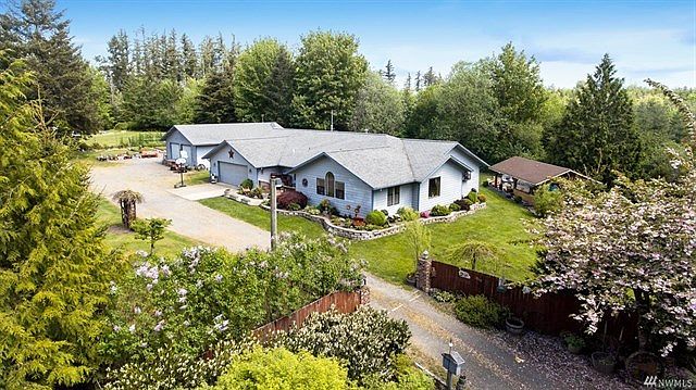 Ample rambler with 740 sq ft garage plus detached shop.  Wonderful private acreage is flat and ready for critters.  Gated entrance too.
