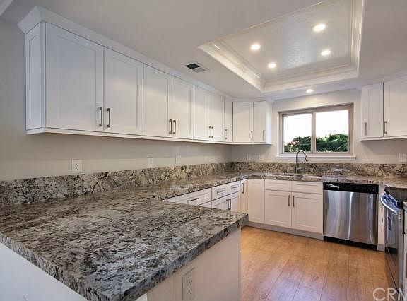 Redesigned kitchen with generous counter space on Alaskan granite counter tops.  All new appliances, fixtures, cabinets and lightening.