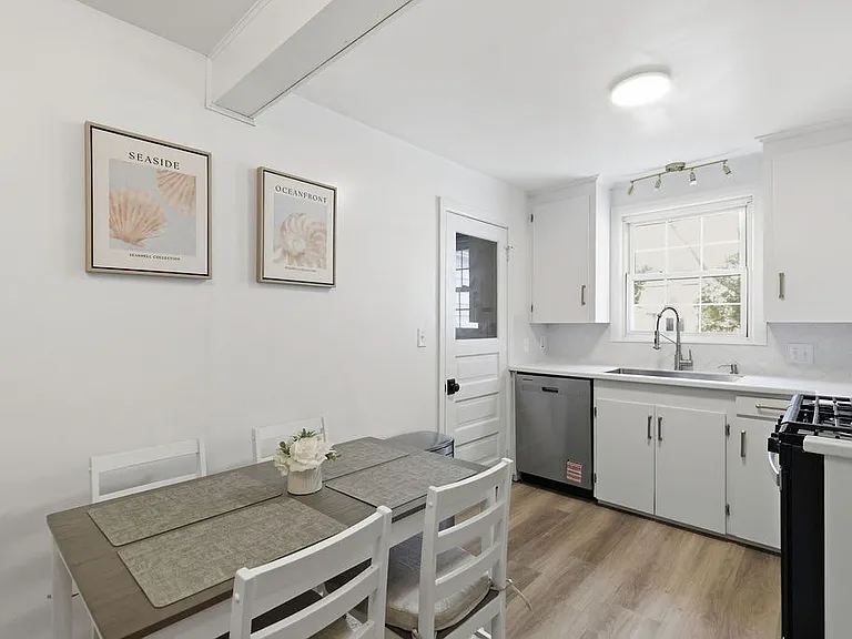 Eat in kitchen is bright, beautifully appointed kitchen