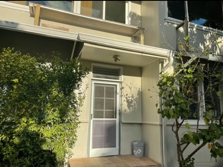 Tall mock orange trees give privacy. New front door installed 09/2024, new tile on steps installed 2024, new screen door with quiet close - installed 05/2025.