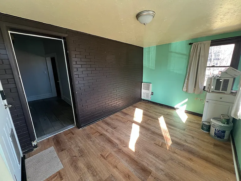 This room is now white and chocolate brown - the green is gone!
