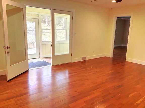 Living Room w/ Sunroom + Backyard Access