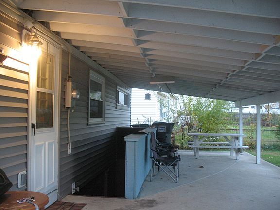 Rear of Home with Full Length Covered Patio