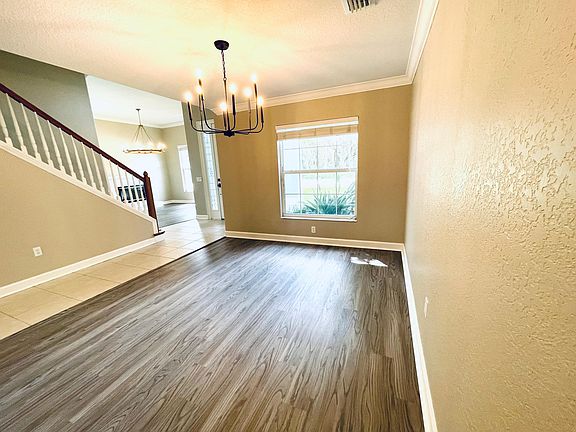 Living room with gray faux hardwood flooring