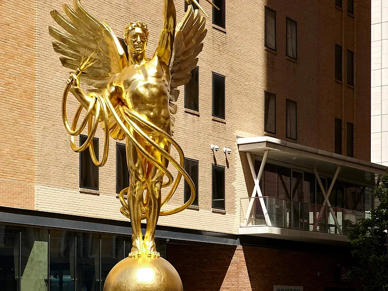 An emblem of Dallas' spirit, the Golden Boy stands tall in the AT&T Discovery District.