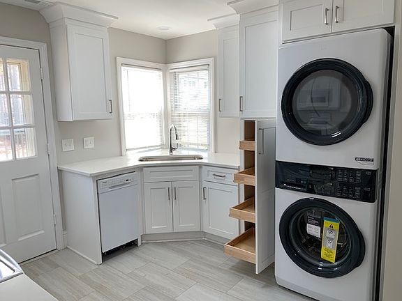 Kitchen: Dishwasher, Stove, Refrigerator with Ice-Maker, OTR Microwave, Stackable Washer & Dryer. Granite countertops.