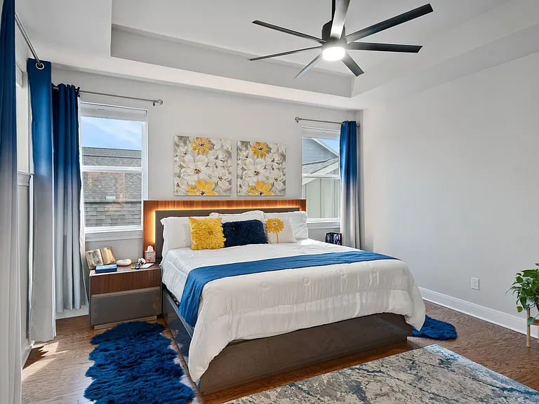 Large primary bedroom with balcony