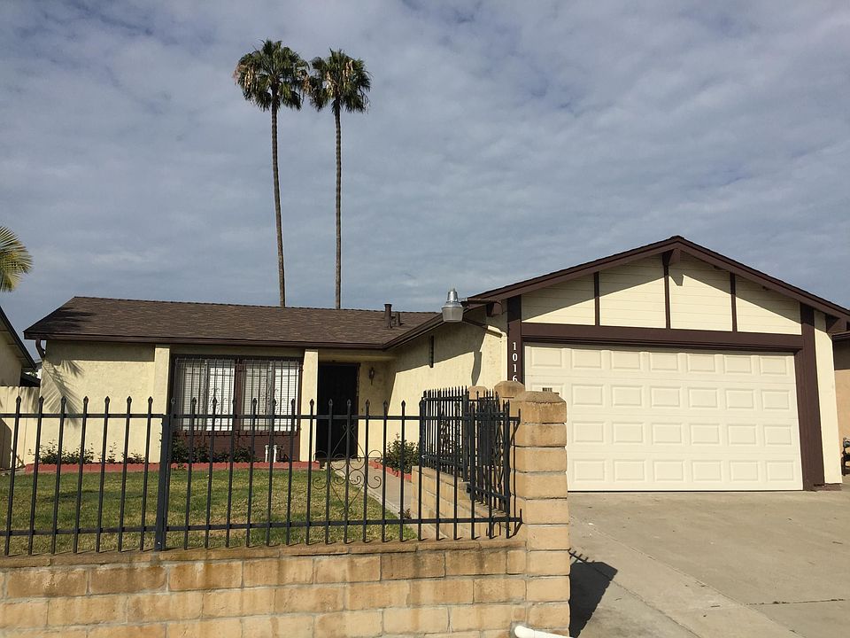 Safe, fenced front and back yards with security gate